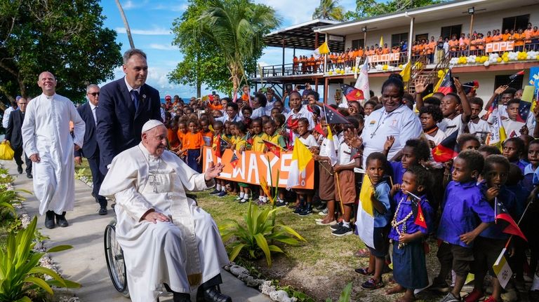 Pope Francis arrives at the Holy Trinity Humanistic School in...