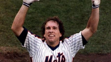 Gary Carter takes one of his famous Shea Stadium curtain...