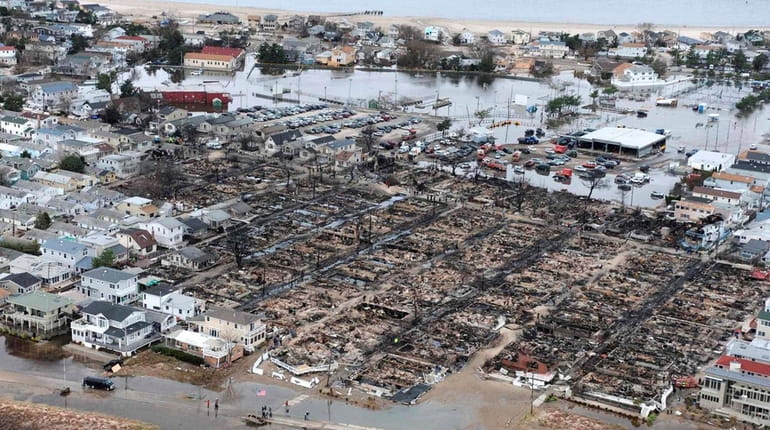 An aerial view shows devastation in a Breezy Point neighborhood...