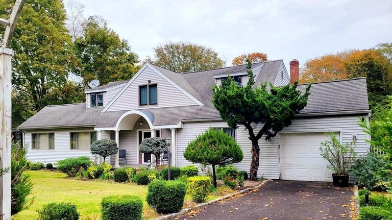 This $1.05 million Mattituck home comes with deeded mooring rights.