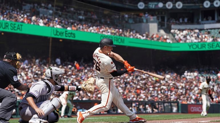 San Francisco Giants' Matt Chapman hits an RBI single against...