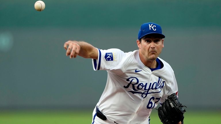 Kansas City Royals starting pitcher Seth Lugo throws during the...