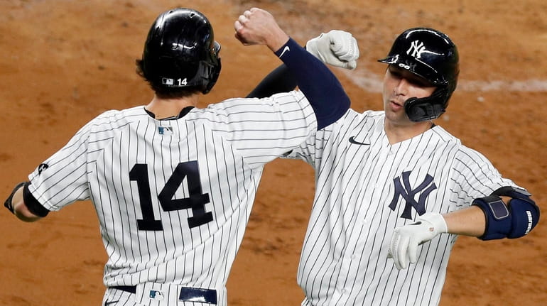Kyle Higashioka of the Yankees celebrates his third-inning two-run home run against...