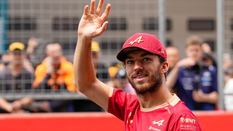 Alpine driver Pierre Gasly of France waves during the drivers...