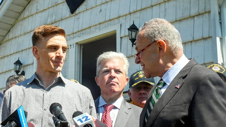 From left, Army veteran Patrick Donohue, Suffolk County Executive Steve...