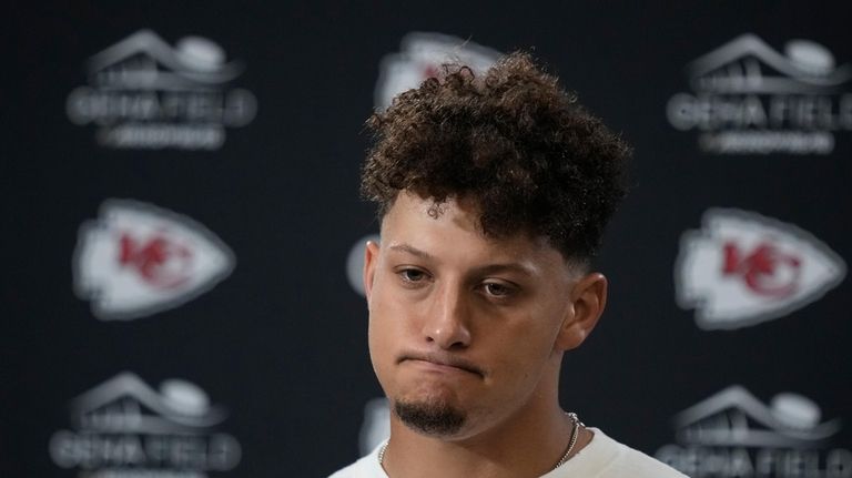 Kansas City Chiefs quarterback Patrick Mahomes pauses during a news...