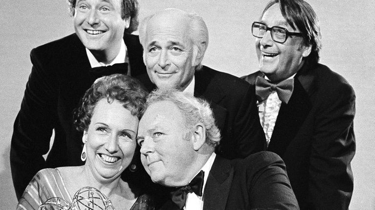 Actors Jean Stapleton, seated, left, and Carroll O'Connor, seated, right,...