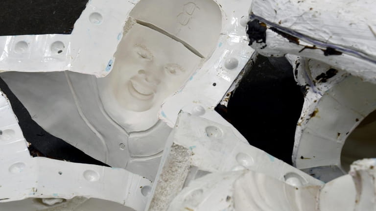 Rubber and plaster molds for a Jackie Robinson statue are...