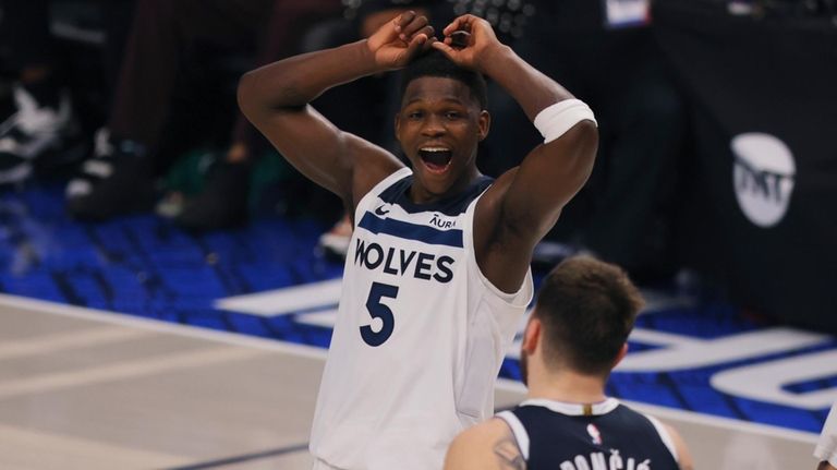 Minnesota Timberwolves guard Anthony Edwards (5) reacts to a play...