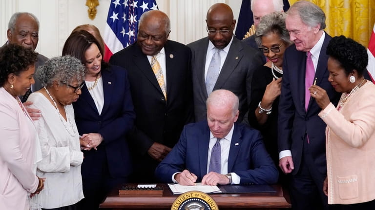 President Joe Biden signs the Juneteenth National Independence Day Act,...