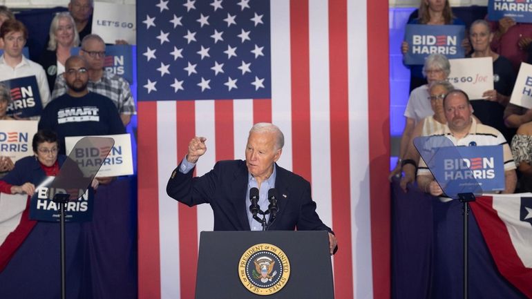 President Joe Biden speaks to supporters during a campaign rally...