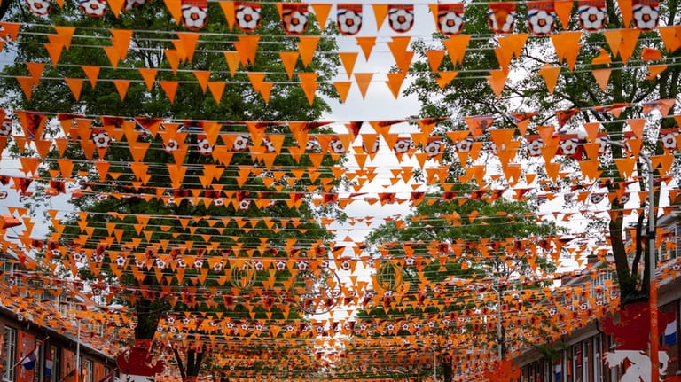 Orange tarp, orange bunting, and Dutch national flags decorate Marktweg...