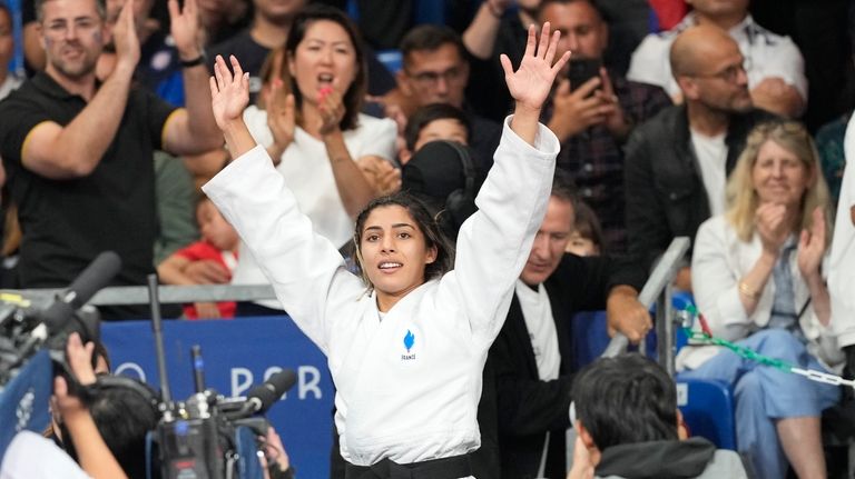 France's Shirine Boukli celebrates after defeating Spain's Laura Martinez Abelenda...