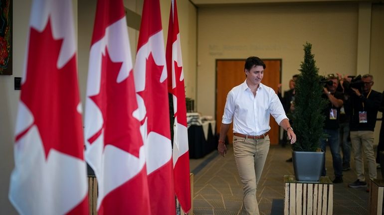 Canada Prime Minister Justin Trudeau arrives to speak to reporters...