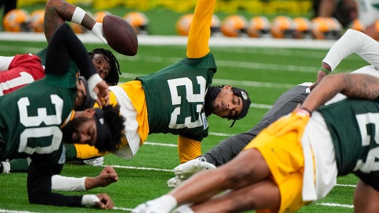 Green Bay Packers' Jaire Alexander stretches during an NFL football...