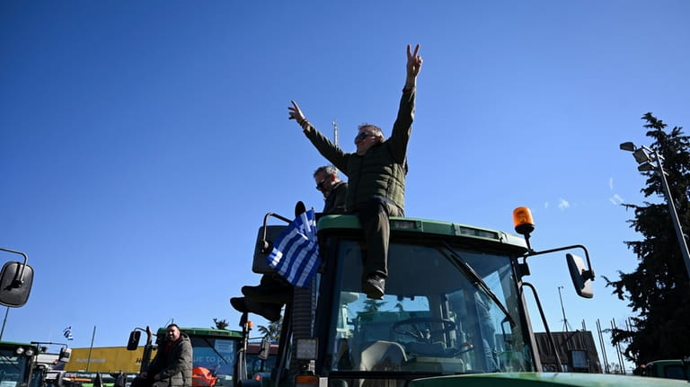 Protesting farmers with their tractors take part in a rally...