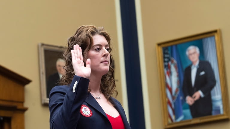 Allison Schmitt, a former Olympic athlete, is sworn in during...