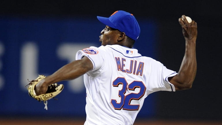 Jenrry Mejia pitching in the 6th inning in relief of...