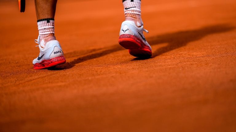 Rafael Nadal of Spain prepares to serve against Marton Fucsovics...