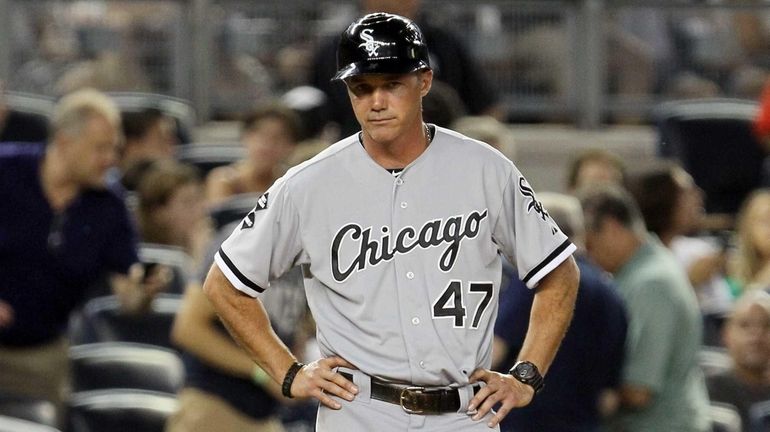 Third base coach Joe McEwing of the Chicago White Sox...