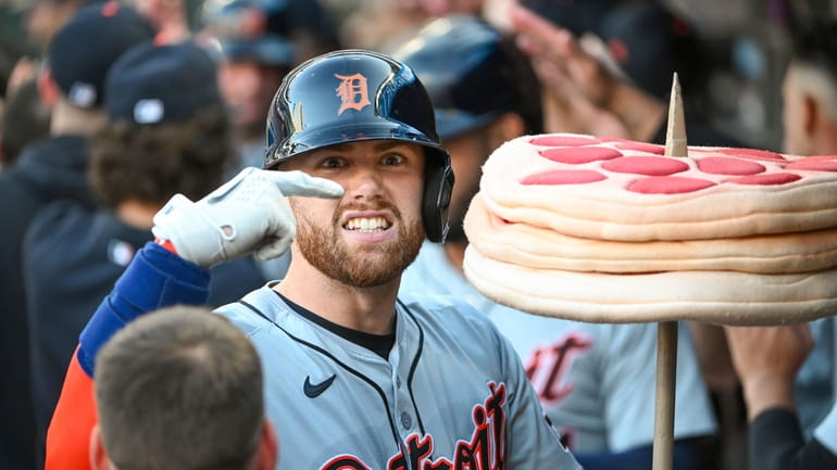 Detroit Tigers' Carson Kelly gestures as he celebrates in the...