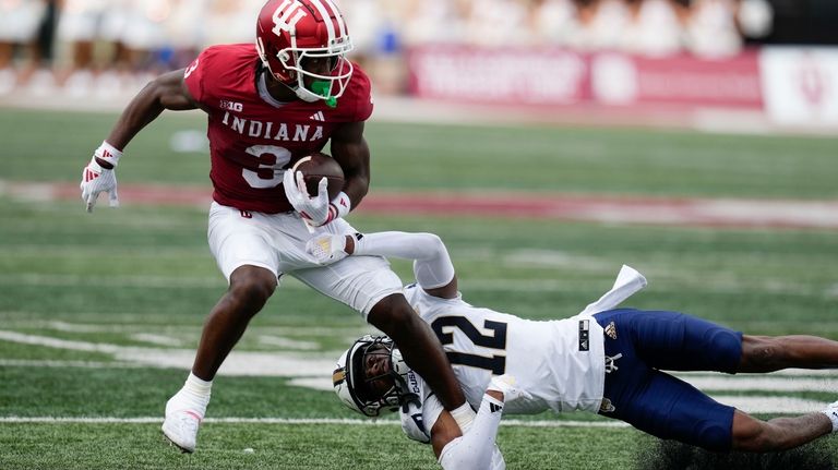 Indiana wide receiver Omar Cooper Jr. (3) is tackled by...