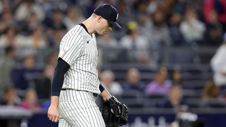 Clay Holmes of the Yankees reacts during the ninth inning against...