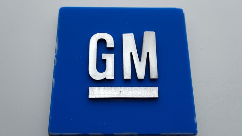 A General Motors logo is displayed outside the General Motors...