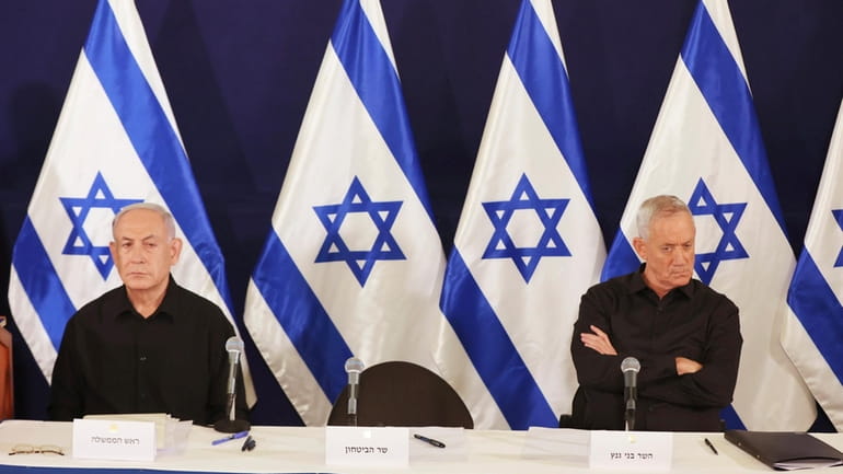 Israeli Prime Minister Benjamin Netanyahu and Cabinet Minister Benny Gantz...