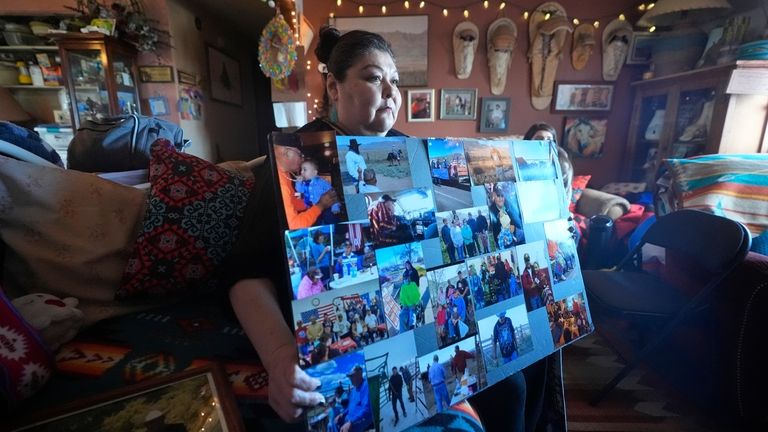 Shoshone-Paiute tribal member Tanya Smith Beaudoin holds photos of her...