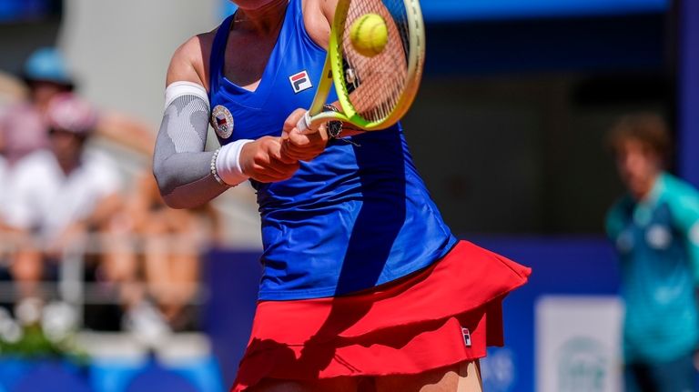 Barbora Krejcikova of Czech Republic returns the ball against Sara...