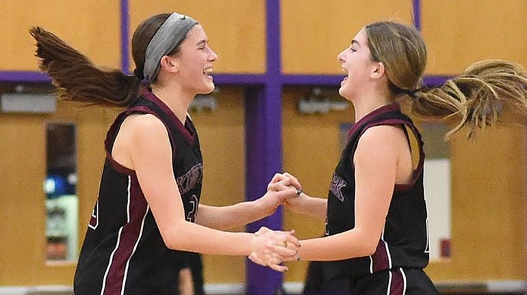 Gianna Zawol of Kings Park, left, and Melanie New celebrate...