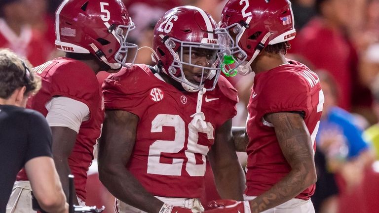 Alabama running back Jam Miller (26) celebrates his touchdown with...