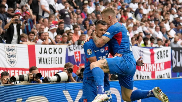 Slovakia's Ivan Schranz, left, celebrates with Slovakia's Juraj Kucka after...