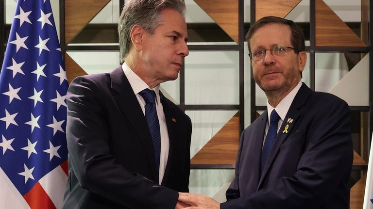 U.S. Secretary of State Blinken, left, meets with Israel's President...