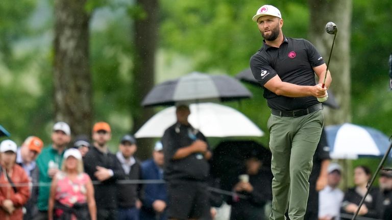 Jon Rahm, of Spain, hits from the fairway on the...