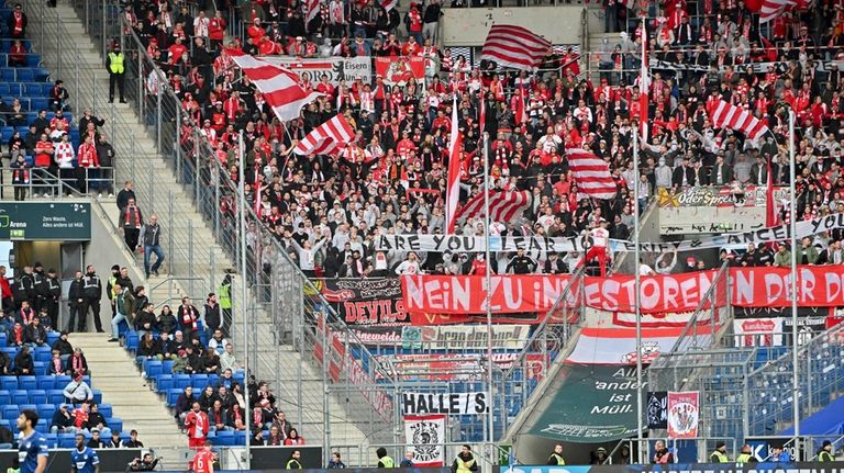 Berlin fans throw tennis balls on the pitch to protest...