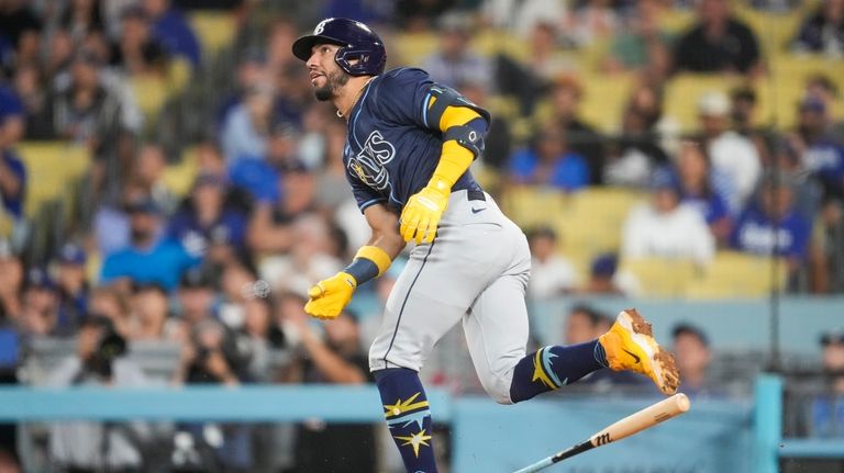 Tampa Bay Rays' José Caballero runs after hitting a home...