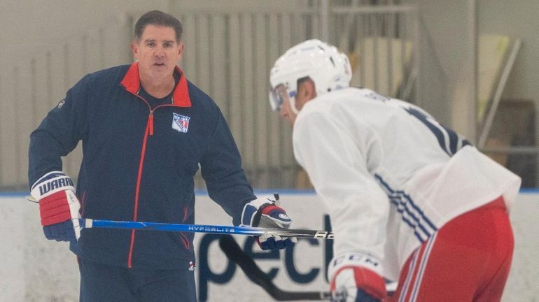 Rangers head coach Peter Laviolette looks on at training camp...