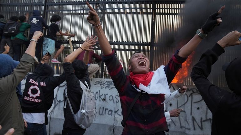 Protesters attempt to storm Indonesia's parliament during a protest against...