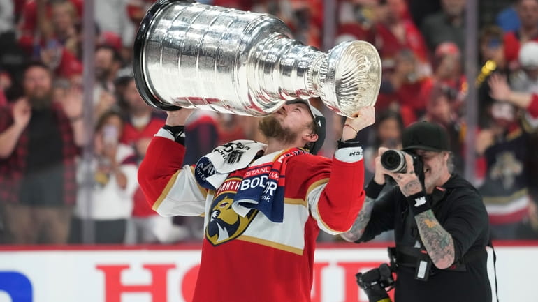 Florida Panthers right wing Vladimir Tarasenko kisses the Stanley Cup...