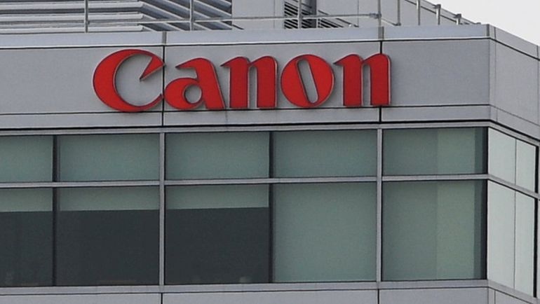 Canon U.S.A. headquarters in Melville, where the company cut between...