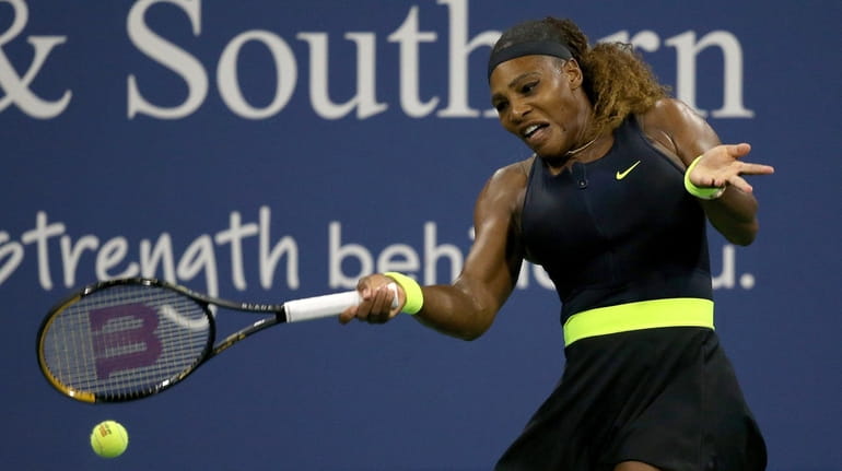 Serena Williams returns a shot to Maria Sakkari during the...