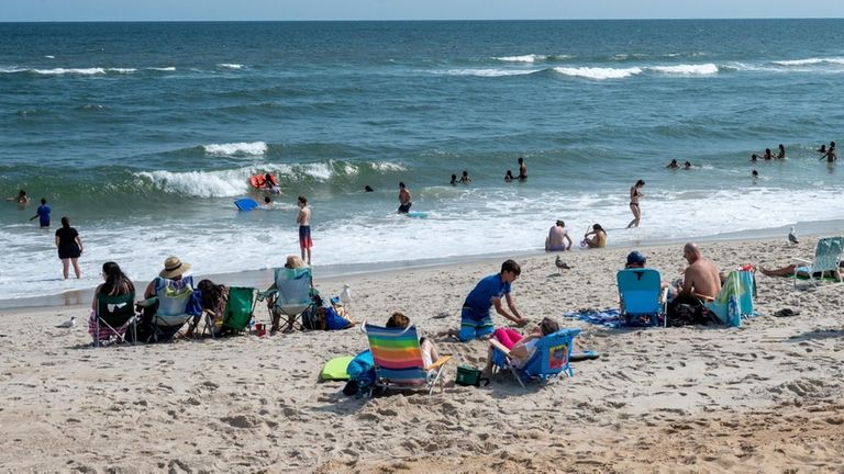 Swimmers in the water at Tobay Beach. 