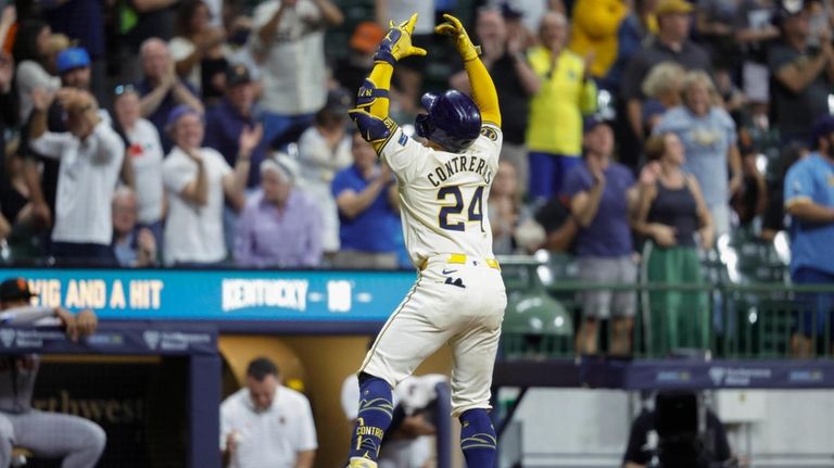 Milwaukee Brewers' William Contreras reacts after his two-run home run...