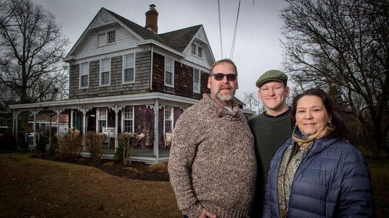 Eleanor Daly Kobel with husband James, left, and son Eamon outside...