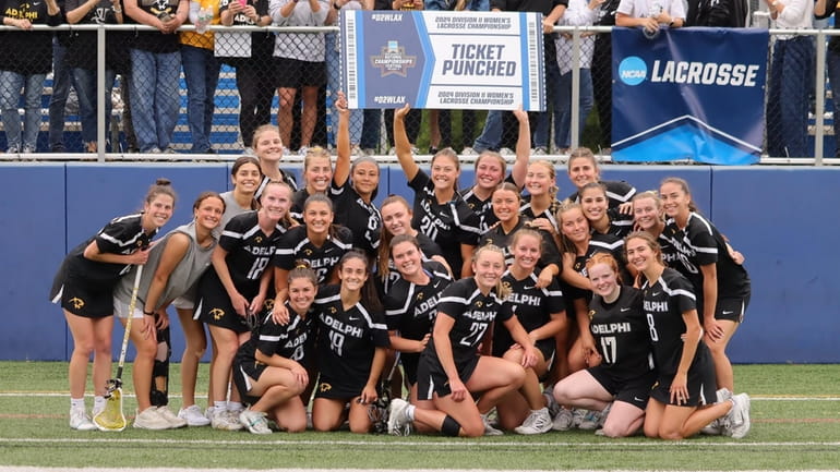 Adelphi celebrates beating Pace University in the NCAA Division II women's...