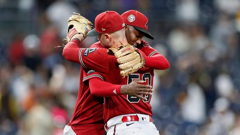 Arizona Diamondbacks shortstop Geraldo Perdomo, left, celebrates a victory with...