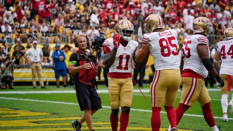 San Francisco 49ers wide receiver Brandon Aiyuk (11) celebrates with...