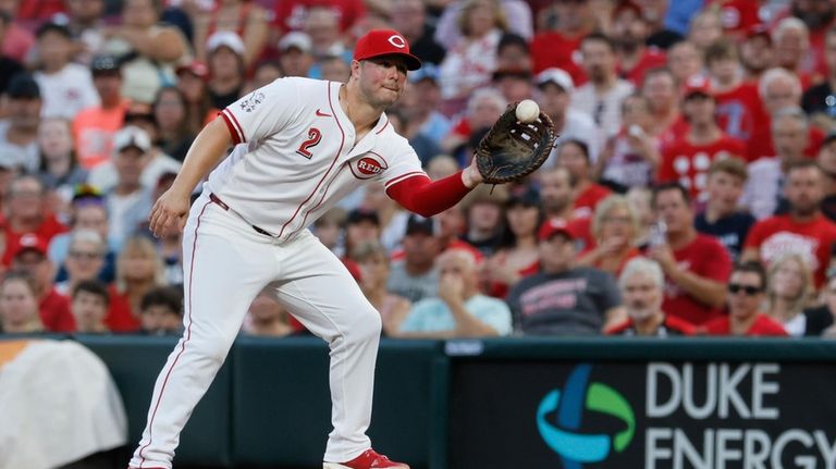 Cincinnati Reds' first baseman Ty France makes a catch to...